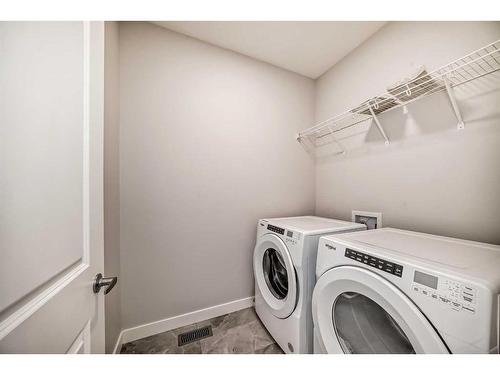 44 Treeline Manor Sw, Calgary, AB - Indoor Photo Showing Laundry Room