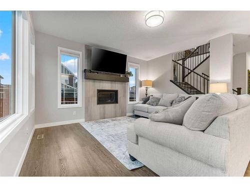 248 Sandpiper Crescent, Chestermere, AB - Indoor Photo Showing Living Room With Fireplace