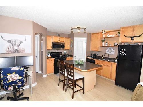 105-31 Everridge Square Sw, Calgary, AB - Indoor Photo Showing Kitchen With Double Sink