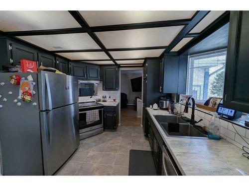 1102 Whitfield Avenue, Crossfield, AB - Indoor Photo Showing Kitchen With Stainless Steel Kitchen