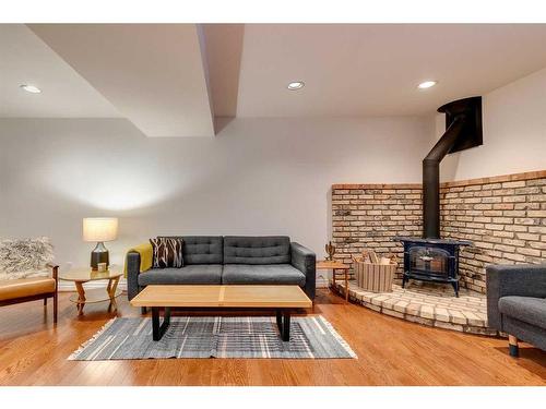 215 11A Street Nw, Calgary, AB - Indoor Photo Showing Living Room With Fireplace