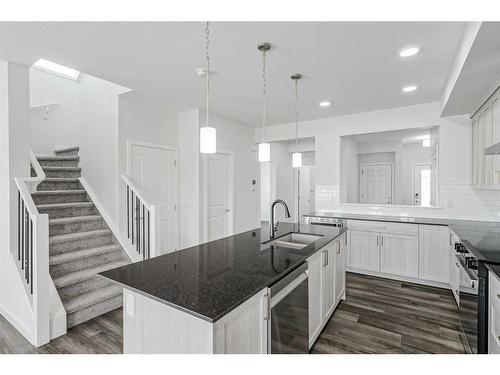 17 Creekstone Place Sw, Calgary, AB - Indoor Photo Showing Kitchen With Double Sink With Upgraded Kitchen