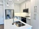 2220-395 Skyview Parkway Ne, Calgary, AB  - Indoor Photo Showing Kitchen With Double Sink With Upgraded Kitchen 