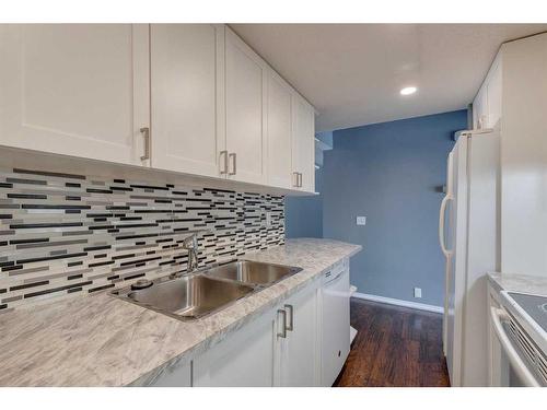 96-1055 72 Avenue Nw, Calgary, AB - Indoor Photo Showing Kitchen With Double Sink With Upgraded Kitchen