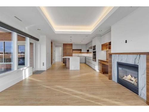 802-600 Princeton Way Sw, Calgary, AB - Indoor Photo Showing Living Room With Fireplace