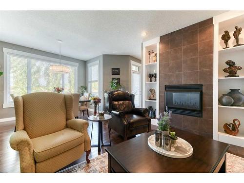 129 Rainbow Falls Boulevard, Chestermere, AB - Indoor Photo Showing Living Room With Fireplace