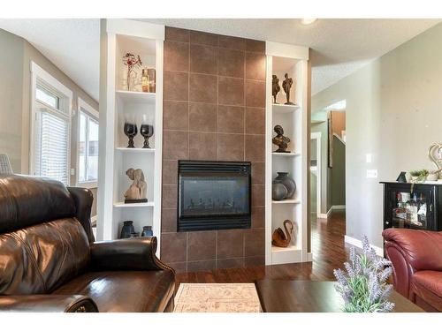 129 Rainbow Falls Boulevard, Chestermere, AB - Indoor Photo Showing Living Room With Fireplace