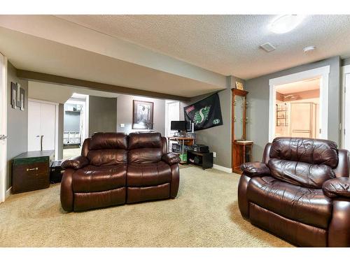 129 Rainbow Falls Boulevard, Chestermere, AB - Indoor Photo Showing Living Room