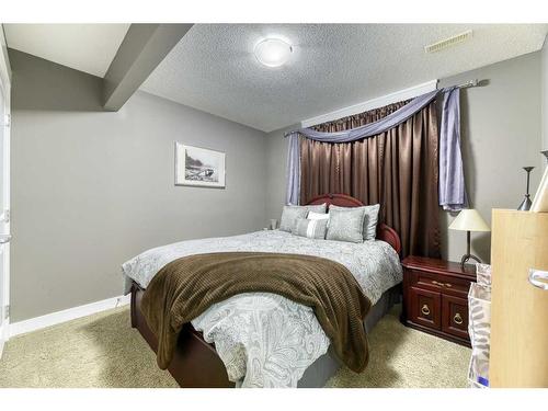 129 Rainbow Falls Boulevard, Chestermere, AB - Indoor Photo Showing Bedroom