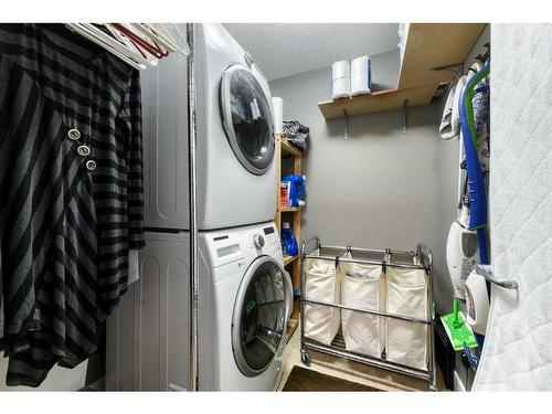 129 Rainbow Falls Boulevard, Chestermere, AB - Indoor Photo Showing Laundry Room