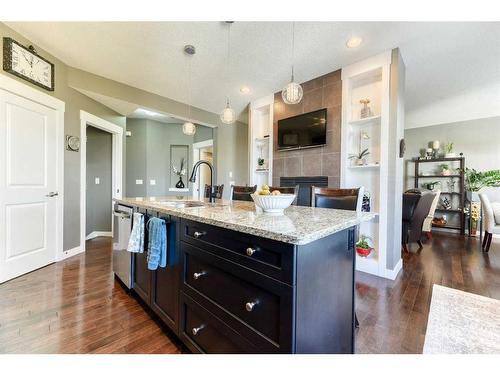 129 Rainbow Falls Boulevard, Chestermere, AB - Indoor Photo Showing Kitchen With Upgraded Kitchen