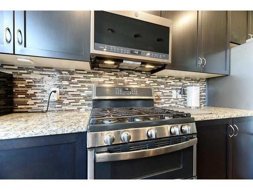 129 Rainbow Falls Boulevard, Chestermere, AB - Indoor Photo Showing Kitchen With Stainless Steel Kitchen With Upgraded Kitchen