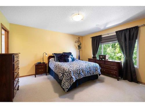 115 Chapala Drive Se, Calgary, AB - Indoor Photo Showing Bedroom