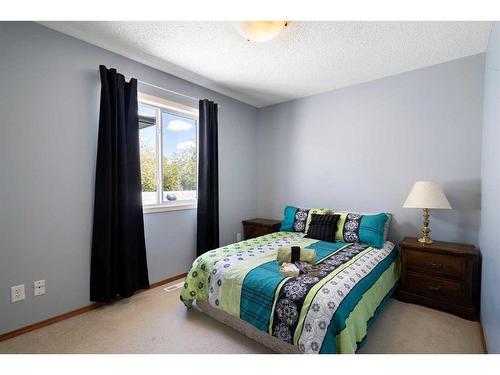 115 Chapala Drive Se, Calgary, AB - Indoor Photo Showing Bedroom