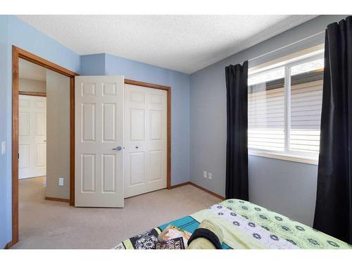 115 Chapala Drive Se, Calgary, AB - Indoor Photo Showing Bedroom