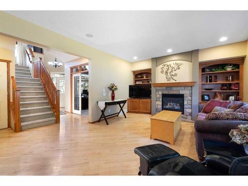 115 Chapala Drive Se, Calgary, AB - Indoor Photo Showing Living Room With Fireplace