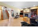 115 Chapala Drive Se, Calgary, AB  - Indoor Photo Showing Living Room With Fireplace 