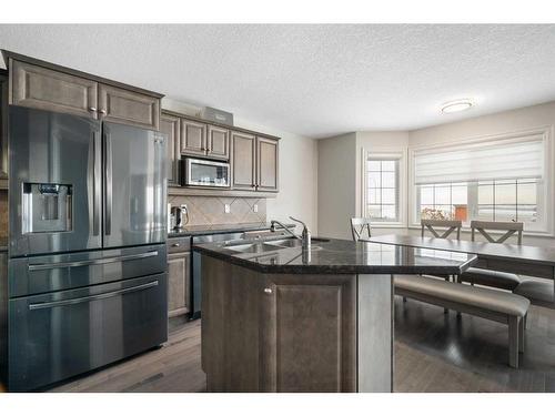 43 Prominence Path Sw, Calgary, AB - Indoor Photo Showing Kitchen With Double Sink