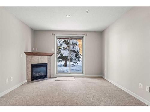 3103-92 Crystal Shores Road, Okotoks, AB - Indoor With Fireplace