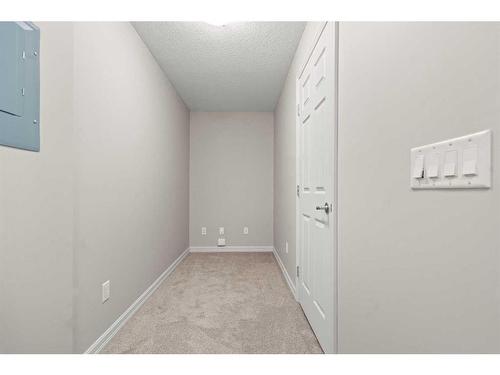 3103-92 Crystal Shores Road, Okotoks, AB - Indoor Photo Showing Other Room