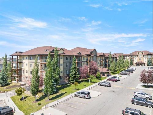 3103-92 Crystal Shores Road, Okotoks, AB - Outdoor With Balcony With Facade