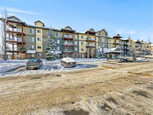 3103-92 Crystal Shores Road, Okotoks, AB - Outdoor With Balcony With Facade