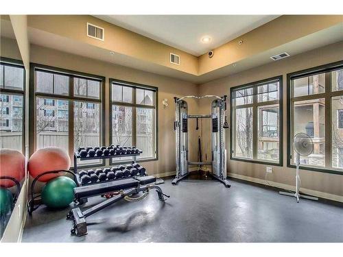 3103-92 Crystal Shores Road, Okotoks, AB - Indoor Photo Showing Gym Room