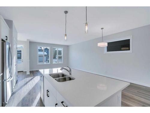 1139 Chinook Winds Circle Sw, Airdrie, AB - Indoor Photo Showing Kitchen With Double Sink