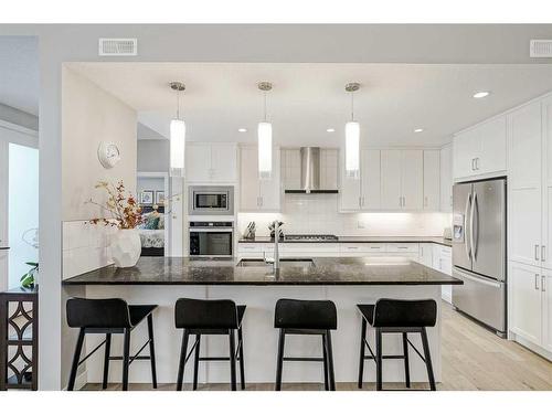 51 Quarry Common Se, Calgary, AB - Indoor Photo Showing Kitchen With Upgraded Kitchen