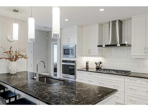 51 Quarry Common Se, Calgary, AB - Indoor Photo Showing Kitchen With Upgraded Kitchen