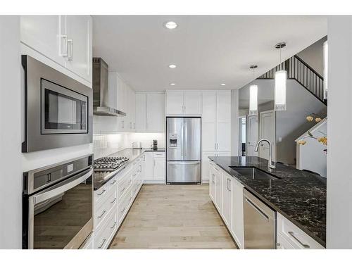 51 Quarry Common Se, Calgary, AB - Indoor Photo Showing Kitchen With Upgraded Kitchen