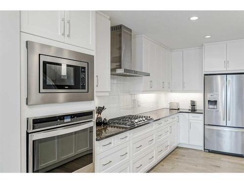 51 Quarry Common Se, Calgary, AB - Indoor Photo Showing Kitchen With Upgraded Kitchen