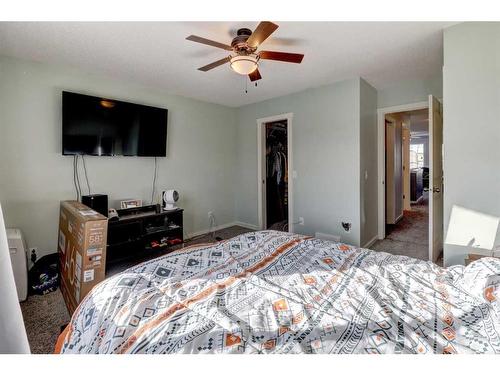 1227 Kings Heights Road Se, Airdrie, AB - Indoor Photo Showing Bedroom