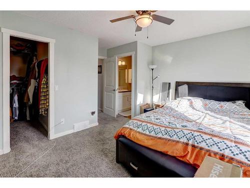 1227 Kings Heights Road Se, Airdrie, AB - Indoor Photo Showing Bedroom