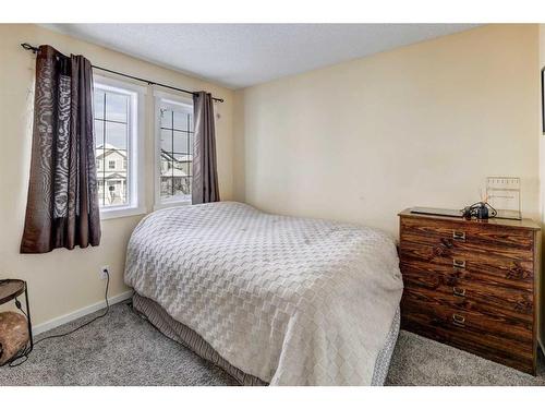 1227 Kings Heights Road Se, Airdrie, AB - Indoor Photo Showing Bedroom