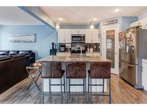 1227 Kings Heights Road Se, Airdrie, AB - Indoor Photo Showing Kitchen With Upgraded Kitchen