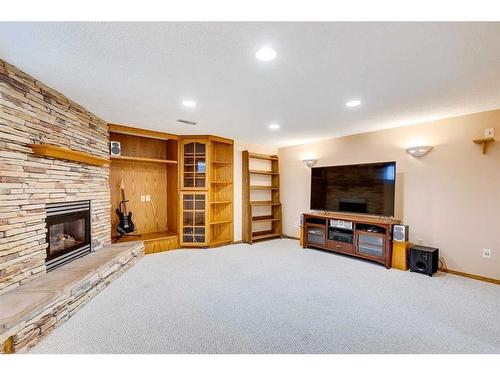 107 Hawkmount Close Nw, Calgary, AB - Indoor With Fireplace