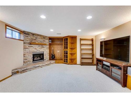 107 Hawkmount Close Nw, Calgary, AB - Indoor With Fireplace