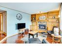 107 Hawkmount Close Nw, Calgary, AB  - Indoor Photo Showing Living Room With Fireplace 