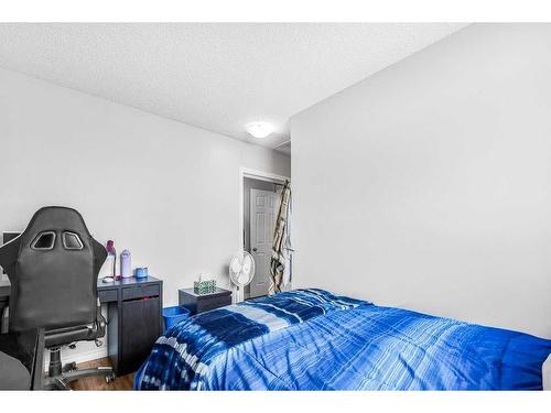 5-200 Hidden Hills Terrace Nw, Calgary, AB - Indoor Photo Showing Bedroom