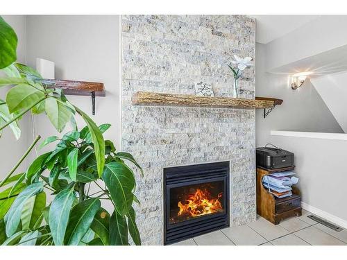 5-200 Hidden Hills Terrace Nw, Calgary, AB - Indoor With Fireplace