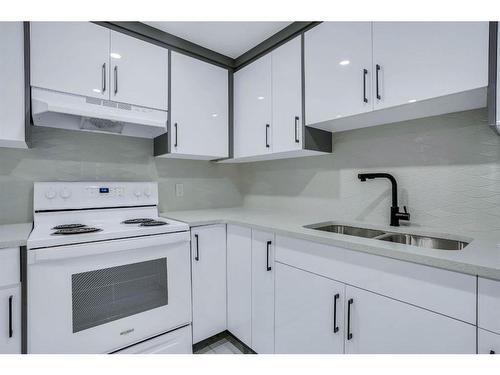 1304 Pennsburg Road Se, Calgary, AB - Indoor Photo Showing Kitchen With Double Sink