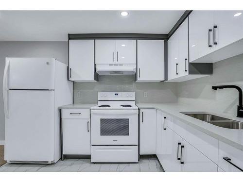 1304 Pennsburg Road Se, Calgary, AB - Indoor Photo Showing Kitchen With Double Sink