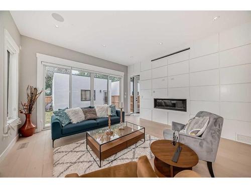 615 19 Avenue Nw, Calgary, AB - Indoor Photo Showing Living Room With Fireplace