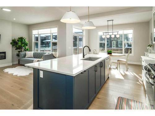 77 Belmont Villas Sw, Calgary, AB - Indoor Photo Showing Kitchen With Fireplace With Upgraded Kitchen