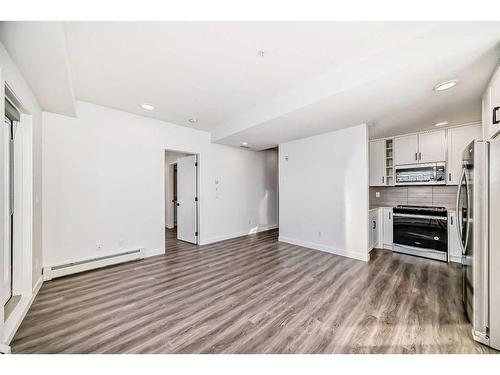 3108-350 Livingston Common Ne, Calgary, AB - Indoor With Fireplace