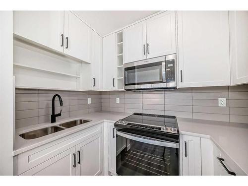 3108-350 Livingston Common Ne, Calgary, AB - Indoor Photo Showing Kitchen With Double Sink