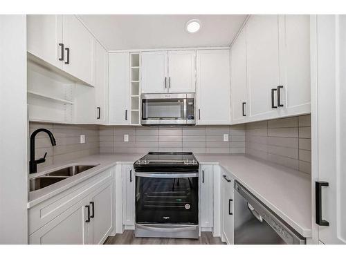 3108-350 Livingston Common Ne, Calgary, AB - Indoor Photo Showing Kitchen With Double Sink