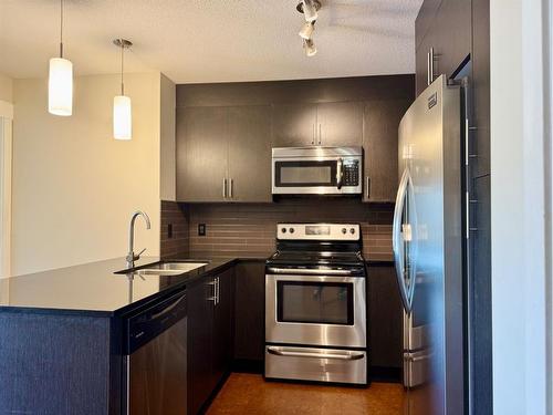 1411-240 Skyview Ranch Road Ne, Calgary, AB - Indoor Photo Showing Kitchen With Stainless Steel Kitchen With Upgraded Kitchen