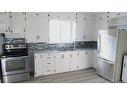 123 1 Street East, Brooks, AB  - Indoor Photo Showing Kitchen With Stainless Steel Kitchen With Double Sink With Upgraded Kitchen 